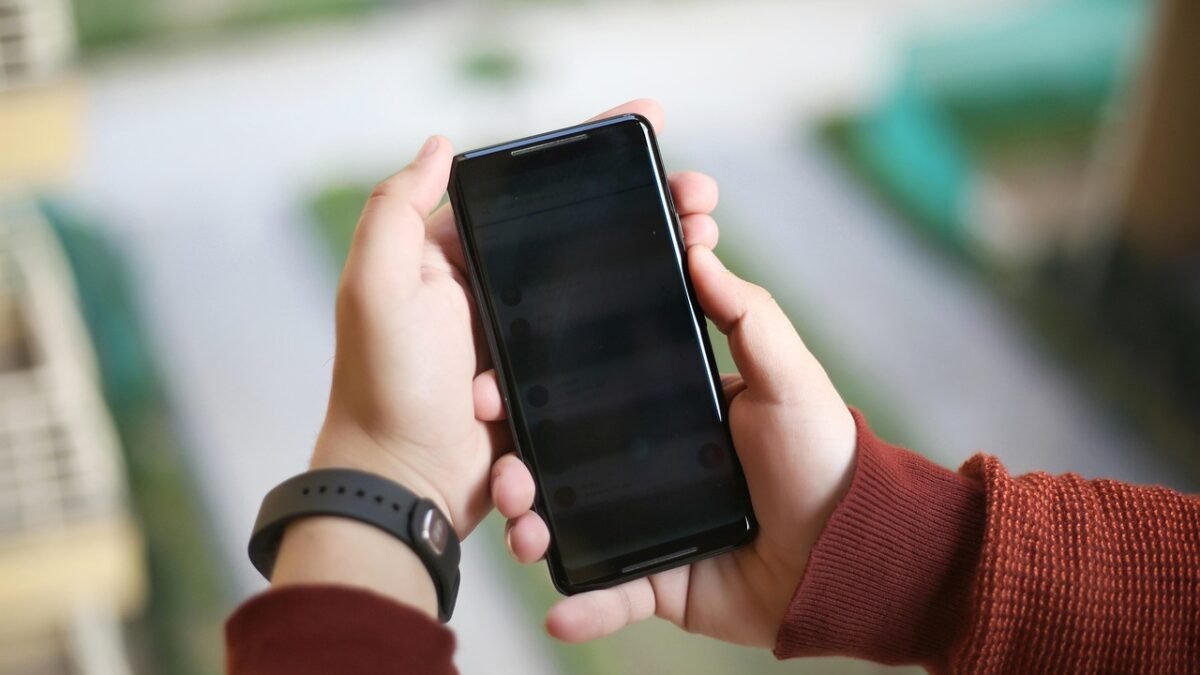 Two hands holding an Android smartphone