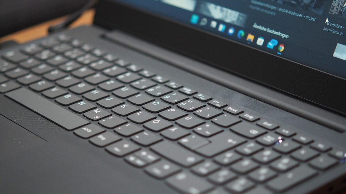 Windows 11 laptop with the taskbar and a page of images on screen